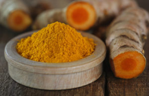 turmeric benefits drinking turmeric tea image of raw and ground fresh turmeric