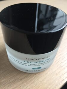 sideways image of Skin Ceuticals A.G.E. interrupter cream pot